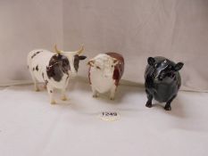 Three Beswick bulls.