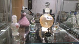 Six various perfume bottles.