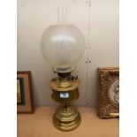 A Victorian brass oil lamp with later etched glass shade. COLLECT ONLY.