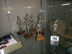 7 military metal figures on wooden bases