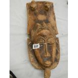 An African Grebo style mask, 44 x 20 cm.