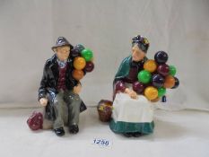 Two Royal Doulton figures - male and female balloon sellers.