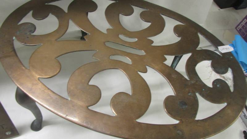 A Brass Aldershot co-op sign and a large oval brass trivet. - Image 3 of 3