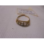 An 18ct gold ring set five diamonds, 3.3 grams, a/f.