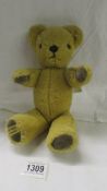 A vintage Merrythought teddy bear.