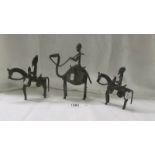 A group of three bronze mounted African figures, 15 cm, 18 cm and 23 cm, age unknown.