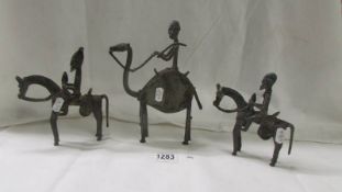 A group of three bronze mounted African figures, 15 cm, 18 cm and 23 cm, age unknown.