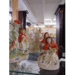 Three Staffordshire figures and a Parian figure.