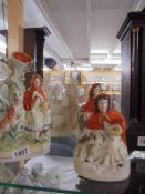 Three Staffordshire figures and a Parian figure.