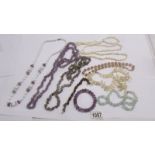 8 assorted necklaces - amethyst, mother of pearl, aquamarine plus amethyst and tigers eye bracelets.
