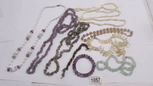 8 assorted necklaces - amethyst, mother of pearl, aquamarine plus amethyst and tigers eye bracelets.