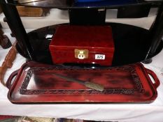 A red lacquered oriental jewellery box, a tray & letter opener