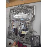 A large mirror in ornate silver coloured frame. COLLECT ONLY.