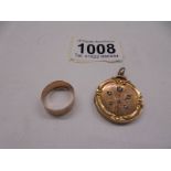 A 9ct gold Victorian locket, 6.4 grams and a 9ct gold wedding ring, 1.8 grams.