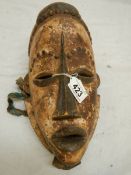 An African ceremonial style mask, 30 x 18 cm.