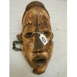 An African ceremonial style mask, 30 x 18 cm.
