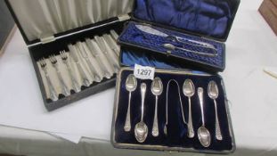 Three cased cutlery sets.