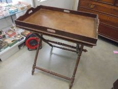 An oak butler's tray on folding stand. COLLECT ONLY.