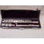 A John Packer Ltd., cased flute with sterling silver head piece.