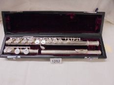 A John Packer Ltd., cased flute with sterling silver head piece.