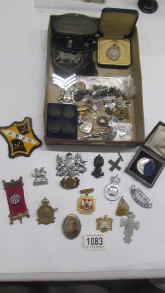 A mixed lot of assorted badges and buttons etc.,