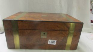 A Victorian mahogany brass banded writing box with ink bottles.