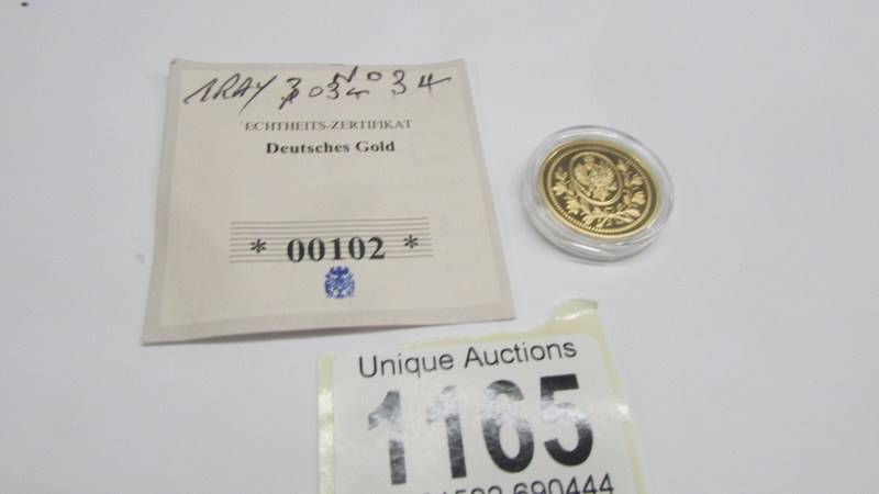 A German coins marked Feine Gold, (plated).