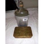 A 1914 Christmas ration tin and a flask