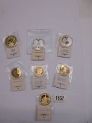 Seven Queen Elizabeth II commemorative coins.