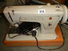 A Singer sewing machine with tatty cover COLLECT ONLY.