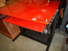 A red glass top office table , COLLECT ONLY.
