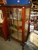 A single door oak display cabinet. COLLECT ONLY.