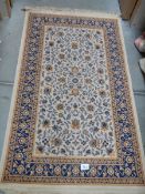 A good quality beige patterned rug. Collect only.