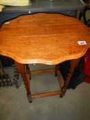 An oak barley twist leg occasional table,. COLLECT ONLY.