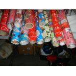 Fourteen rolls of Christmas wrapping paper.