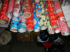 Fourteen rolls of Christmas wrapping paper.