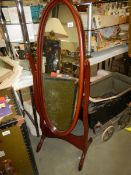 An oval mahogany cheval mirror. COLLECT ONLY.