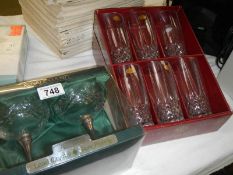 A quantity of boxed glasses.