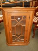 An astragal glazed pine corner cabinet. COLLECT ONLY.