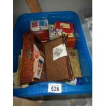 A crate of assorted playing cards etc.,