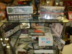 Two shelves of collector's stamps.