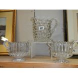 A good quality cube glass vase and a pair of double handled vases. Collect Only.