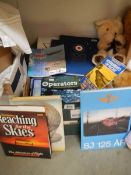 A box of aircraft related books.