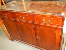 A circa 1970's 4 door 3 drawer glass top sideboard, COLLECT ONLY.