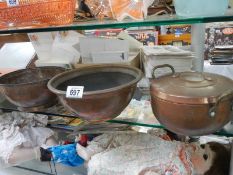Three old copper bowls etc.,