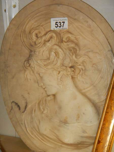 An oval plaque of a lady, a/f.