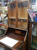 A two door oak bureau bookcase. COLLECT ONLY.