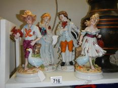Four good continental porcelain figures.