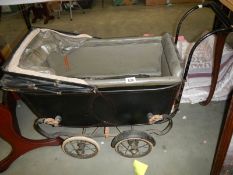 An early 20th century pram. COLLECT ONLY.