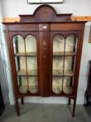 An Edwardian bow front cabinet. COLLECT ONLY.